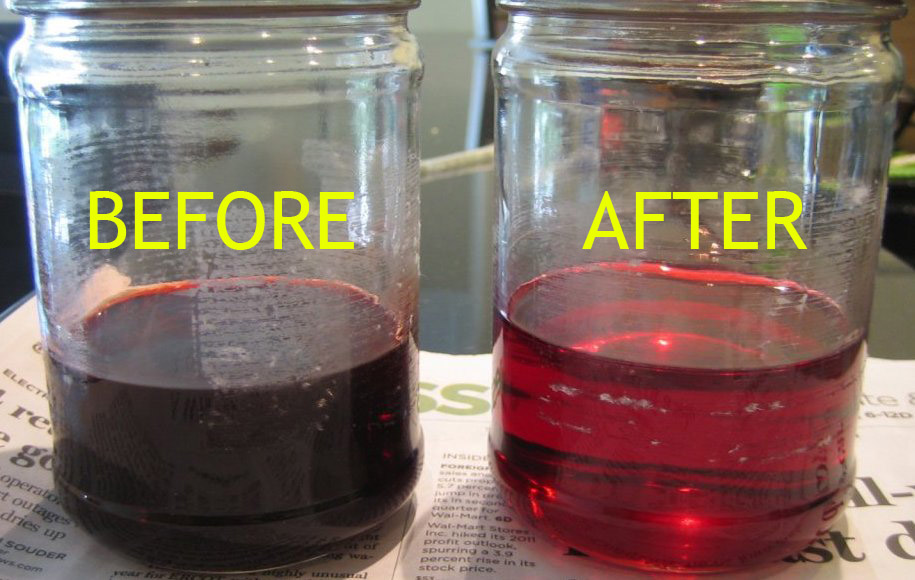 two jars containing auto transmission fluid before and after service